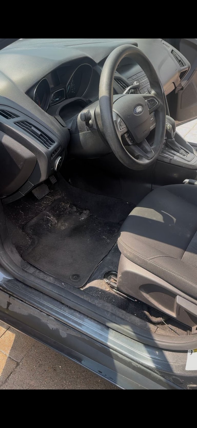 Car interior driver side before detailing